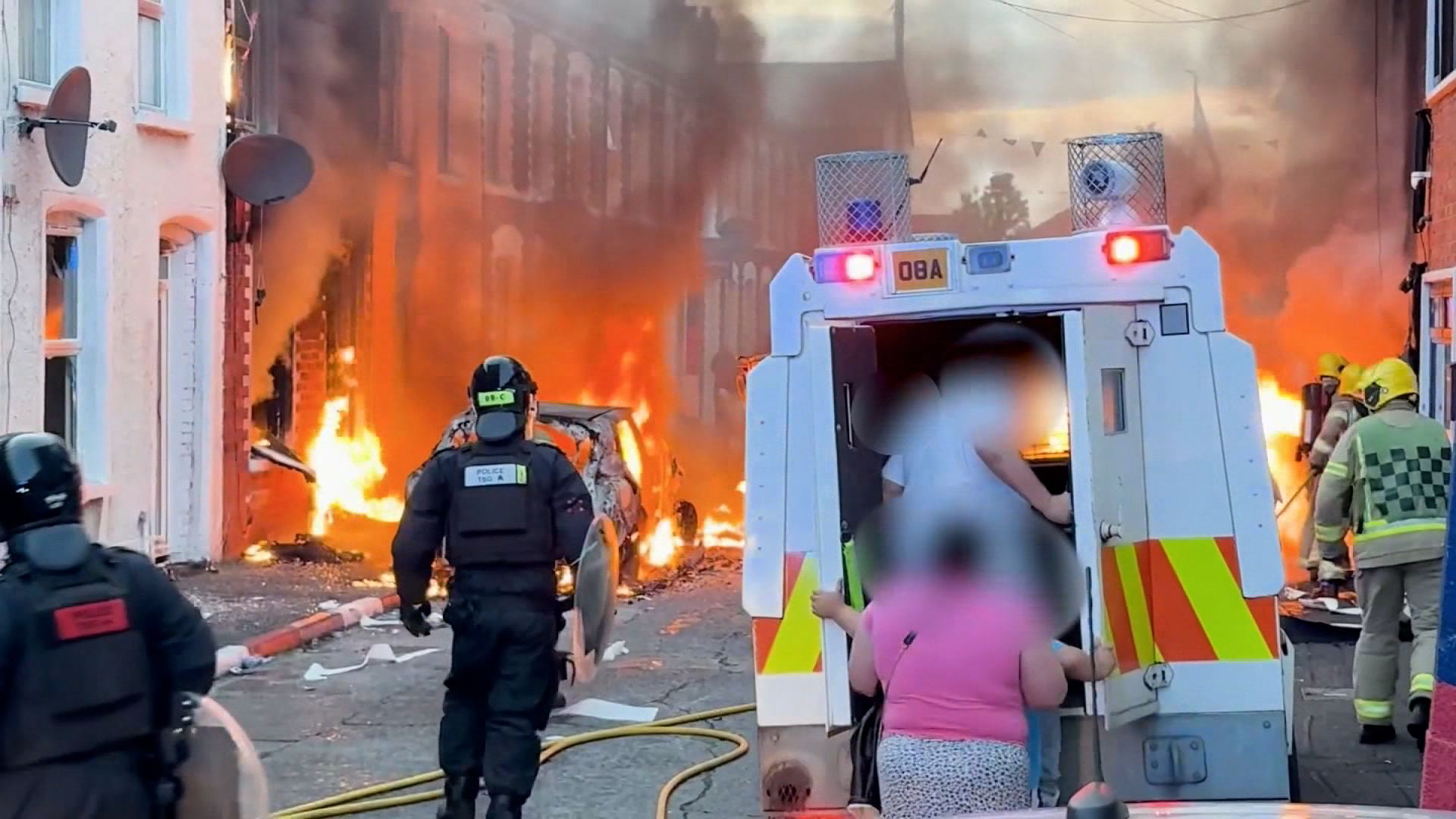 Belfast anti-migrant riots 2026 - burned-out cars and homes in east Belfast following violent protests.