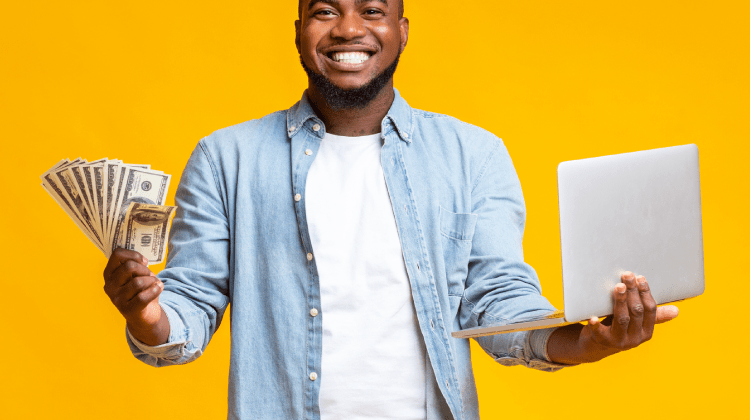 Nigerian working on a laptop at home to earn money online in Nigeria in 2026.